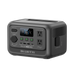 A portable Bluetti power station with multiple input and output ports, an LCD display indicating battery status, two AC outlets, USB ports, and vent grills, set against a plain background.