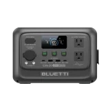 A Bluetti black portable power station with a digital display, control buttons, two AC outlets, and multiple input and output ports, shown against a plain light gray background.
