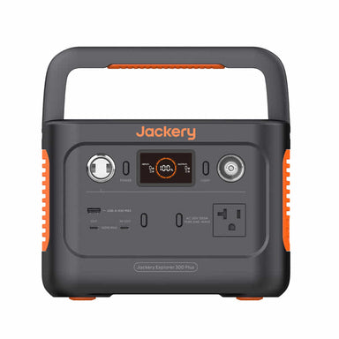 The Jackery portable power station is black with orange accents and features a handle, digital display, USB-A/USB-C ports, AC/DC outputs, and a car charger socket.