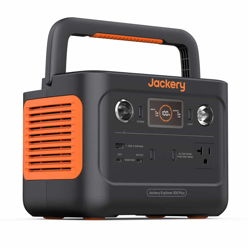 The Jackery portable power station features a vibrant orange and black design with multiple USB and AC ports, a power information display screen, and a top handle. The brand name "Jackery" is prominently displayed.