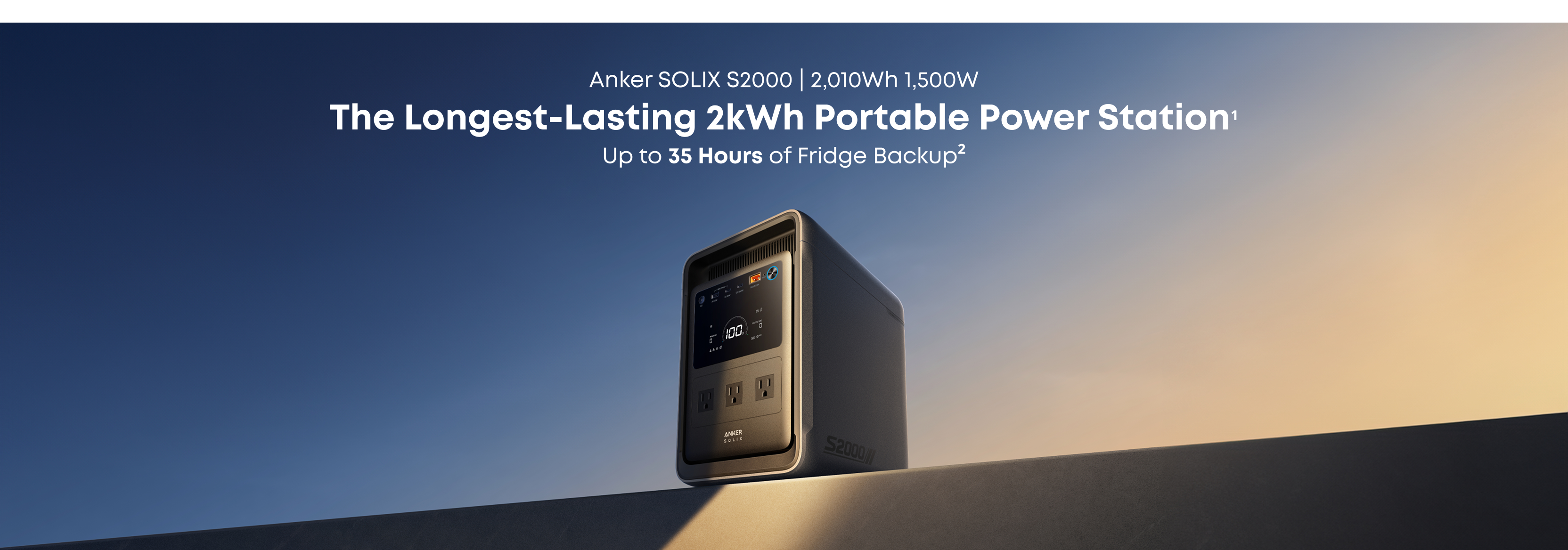 A portable Anker power station with a digital display rests on a flat surface beneath the sky. Text above reads: "Anker SOLIX S2000 | 2,000Wh, 1,500W. The Longest-Lasting 2kWh Portable Power Station. Up to 35 Hours of Fridge Backup.
