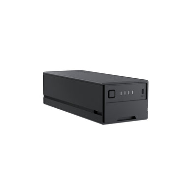 A rectangular black EcoFlow Glacier Plug-In Battery featuring a power button, four LED indicators, and a USB port on one end, perfect as a portable refrigerator battery for outdoor adventures, displayed on a white background.