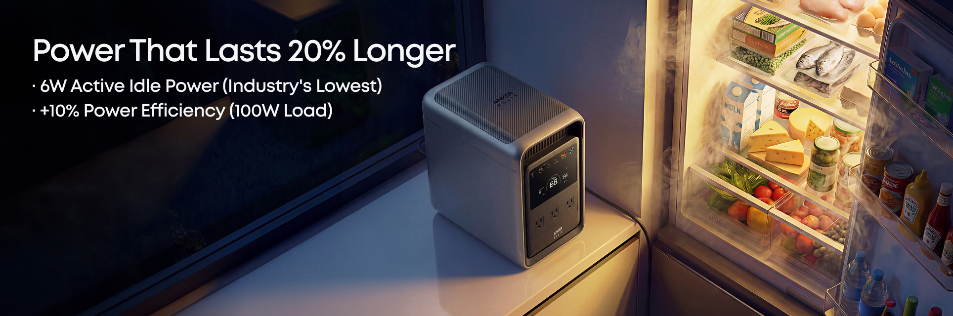 An Anker portable power station sits on a counter next to an open refrigerator stocked with food and drinks. Text on the left highlights Anker’s longer-lasting power and energy-efficient performance. Warm lighting adds to the cozy atmosphere.