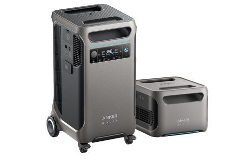 Two portable power stations are displayed. The larger model features wheels, a digital display panel with multiple ports, and is compatible with a solar panel. The smaller unit has a box-shaped design with visible vents. Both prominently showcase the brand name Anker, highlighting their reliability and innovation.