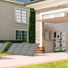 Three Nature's Generator solar panels are set up outside a house. Nearby, a 10kWh Nature's Generator LiFePO4 battery and two storage units back up the home, with a Nature's Generator EV charging station installed by the garage wall.