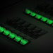 A close-up of a Nature's Generator 12-circuit electrical panel shows several black switches with green indicator lights and a labeled 50 amp transfer switch, all appearing to be in the "on" position.