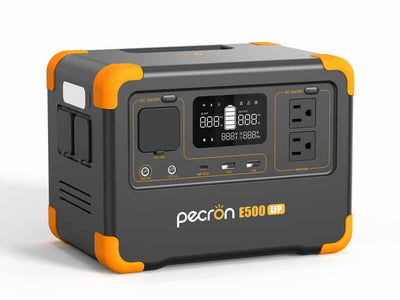 The Pecron E500LFP portable power station features a LiFePo4 battery, digital display screens, control buttons, AC outlets, USB ports, and striking orange corner accents on an elegant dark gray body. With a 600W AC Pure Sine Wave Inverter, it provides dependable power wherever you need it.