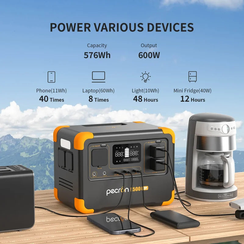 The Pecron E500LFP portable power station can charge a range of devices such as a phone, laptop, light, and mini fridge. It features a durable LiFePo4 battery with 576Wh capacity and offers a 600W AC Pure Sine Wave Inverter output. This reliable power station is positioned alongside two coffee makers with an impressive mountain backdrop.