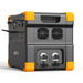 Presenting the Pecron portable power station, designed with a robust rectangular shape and equipped with two front-facing cooling vents. This model includes multiple power outlets and ports and features a LiFePo4 battery for optimized efficiency. It comes in a sleek dark gray and orange color scheme, proudly displaying the brand name "Pecron" on its side.