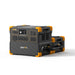 A Pecron portable power station, featuring a black and orange design, is equipped with multiple outlets and a small display screen. The brand name "Pecron" is prominently displayed on the front, and it is paired with an EP3000-48V expansion battery connected at the back.