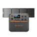 A Bluetti portable power station featuring an orange-accented front panel with outlets and a digital display is positioned in front of four Bluetti-branded rectangular solar panels arranged in a row.