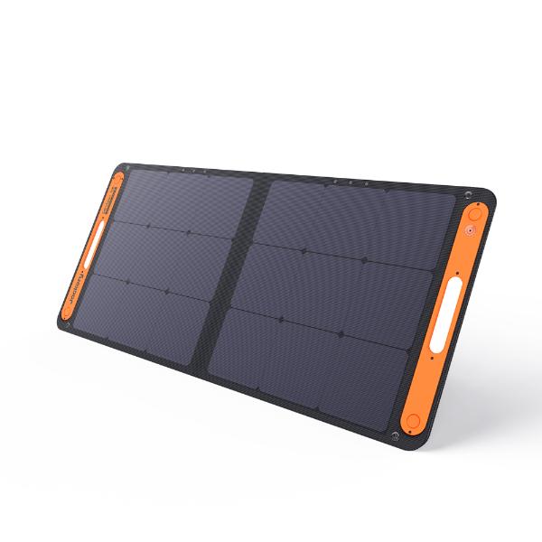 The Jackery high-efficiency rectangular portable solar panel features a black surface with orange edges, two integrated handles, and multiple grid-patterned solar cells—your perfect portable energy solution on the go.