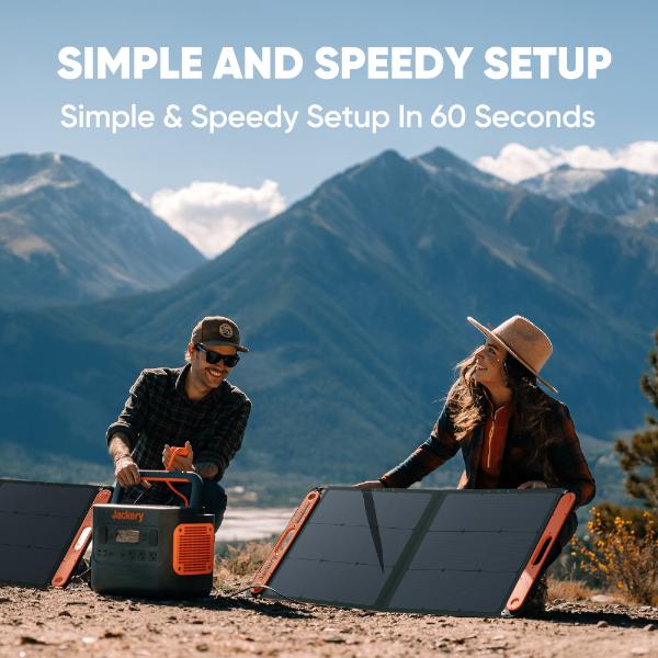 Two people outdoors with mountains behind them set up a Jackery SolarSaga 100W Solar Panel and power station. Text: "Simple & Speedy Setup in 60 Seconds—a portable Jackery energy solution for every adventure.
