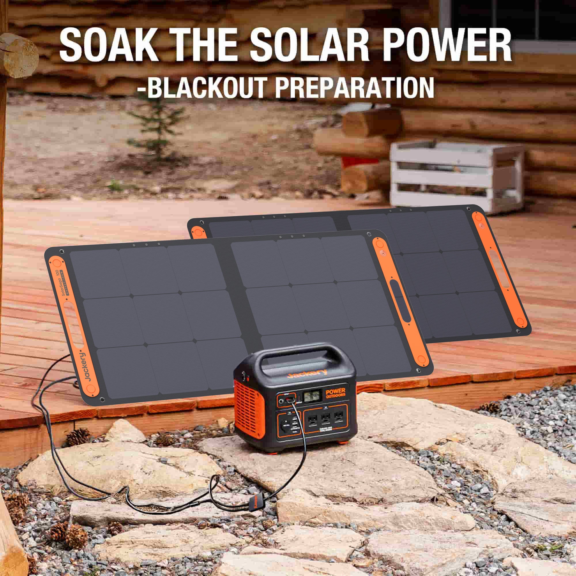 A Jackery portable power station is connected to two Jackery foldable solar panels on rocky ground near a wooden cabin. Text reads "Soak the Solar Power - Blackout Preparation." This Jackery setup rests outside by the porch.