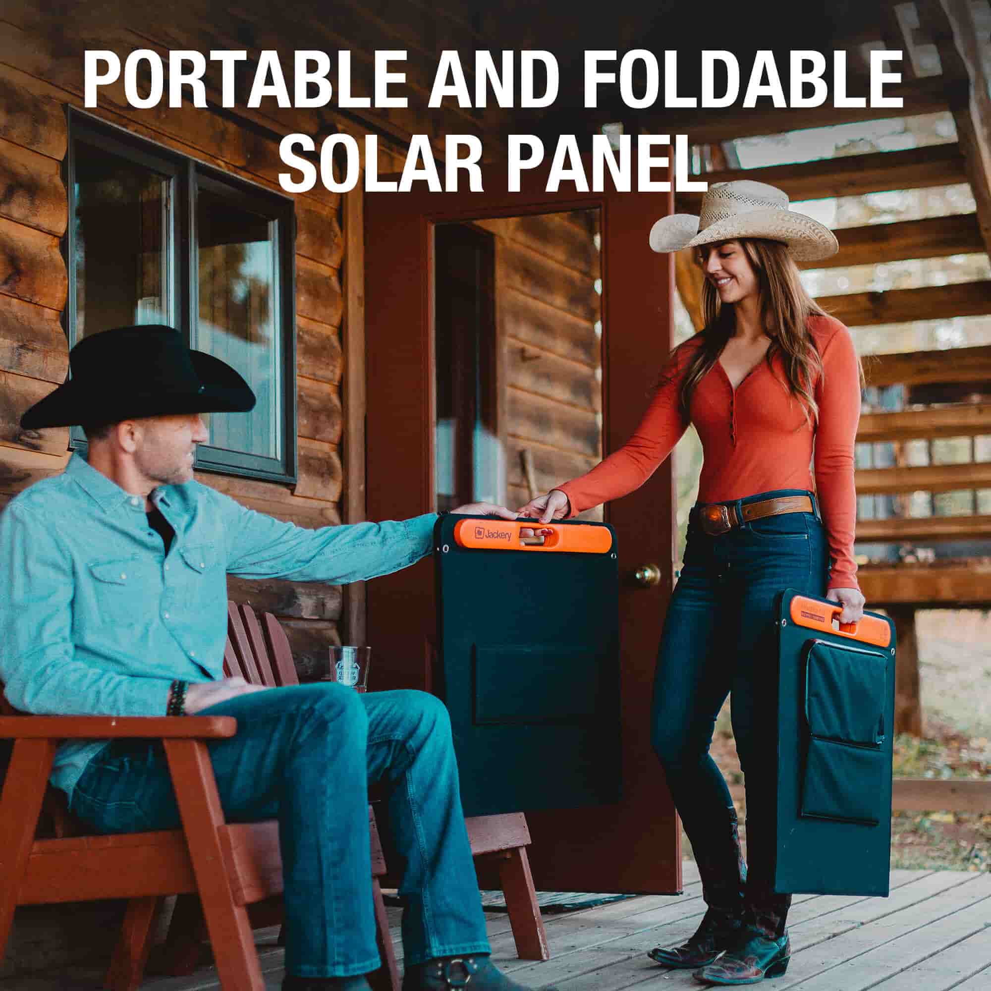 A man and woman in cowboy hats hold a Jackery bifacial, portable, and foldable solar panel outside a wooden cabin. Text above them reads "PORTABLE AND FOLDABLE SOLAR PANEL.