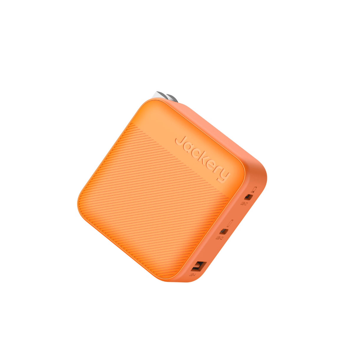 A Jackery orange, rectangular portable power bank with rounded edges, textured surface, and visible USB/USB-C ports plus a compact USB-C charger for 100W fast charging is displayed against a white background.