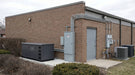 Briggs & Stratton 48kW Fortress commercial standby generator installed at a commercial building's service area