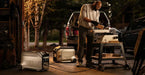 Man using EcoFlow Dual Fuel Smart Generator 4000 to power tools in a workshop setting, showcasing reliability and efficiency at home or on the go.