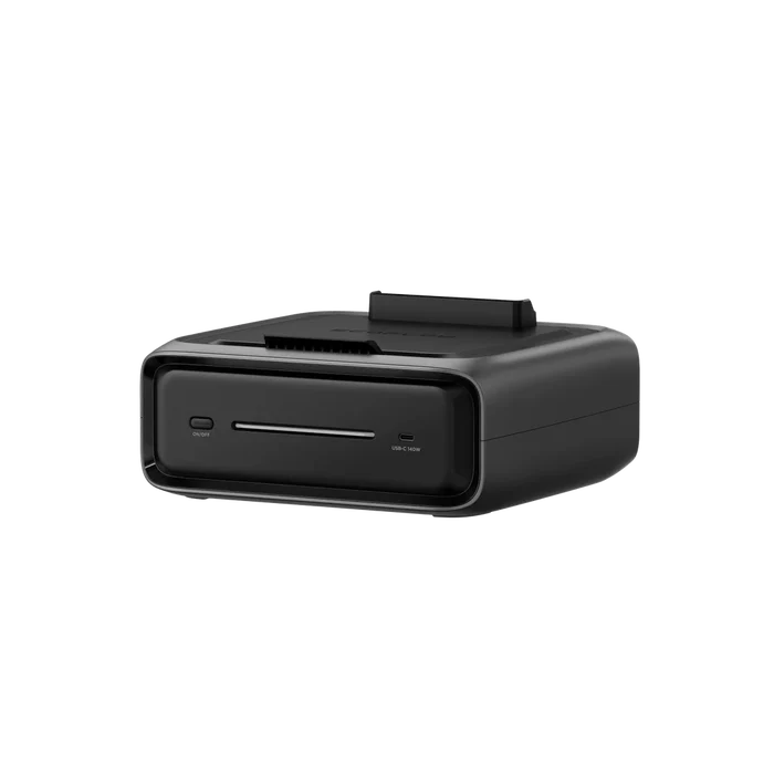 The EcoFlow RIVER 3 Plus is a compact, black rectangular card reader with a front display and card slot. Its sleek design features various rear connectivity options, ensuring portability akin to an energy device with an Extra Battery 300.