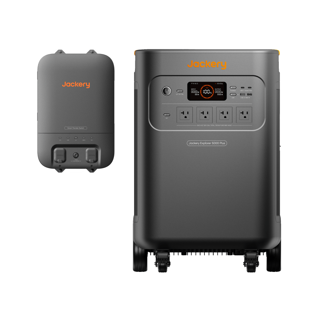 On the right, the Jackery Explorer 5000 Plus portable power station with wheels features a digital display and multiple outlets. On the left is a rectangular Jackery battery pack. Both gray solar generators have orange accents and display the Jackery brand.