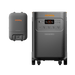 On the right, the Jackery Explorer 5000 Plus portable power station with wheels features a digital display and multiple outlets. On the left is a rectangular Jackery battery pack. Both gray solar generators have orange accents and display the Jackery brand.
