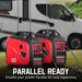 Two PowerSmart 2500W red and black portable generators are pictured connected side by side with cables, RV in background. Text: "PARALLEL READY. Quiet for camping. Parallel kit sold separately.