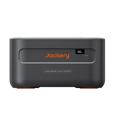 A front view of the Jackery Explorer 1000 Plus Battery Pack displays its black and orange design, a digital "100%" indicator at the top right, and the orange Jackery logo centered. This model features a large capacity Lithium Iron Phosphate battery.