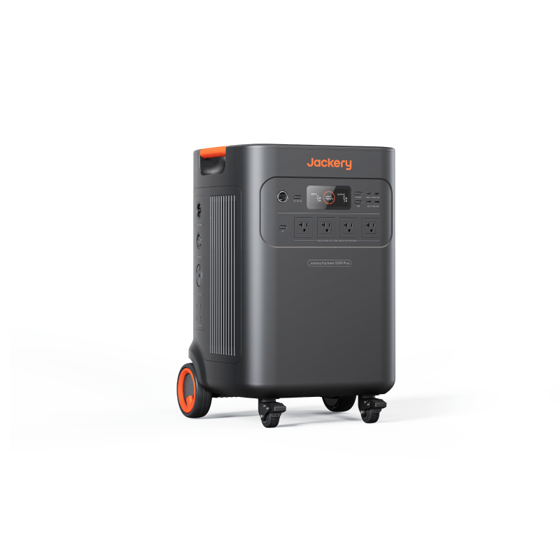 The Jackery Explorer 5000 Plus portable power station features wheels, a handle, multiple front-panel outlets and controls. Finished in dark gray with orange accents and “Jackery” at the top, it’s ideal for backup power needs.