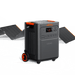 The Jackery portable power station, with orange accents and 3584Wh capacity, is displayed on a white background in front of two unfolded solar panels. It features wheels, multiple outlets, a display screen, and delivers a reliable 3600W output.