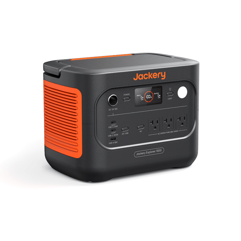 The Jackery Explorer 1500 LiFePO4 power station features orange side vents, a display, control buttons, and multiple outlets on the front panel—ideal for fast charging and powering devices anywhere.