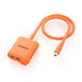 This orange Jackery adapter features a short cable, two input ports on one end, and a single plug on the other—ideal as a solar panel connector for your portable power station. The brand name "Jackery" is printed on the device.