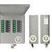 A Nature's Generator metal electrical panel with an open cover reveals circuit breakers and indicator lights. Beside it are two vertical metal boxes—one likely a manual transfer switch for generator setups, featuring circular sockets and wiring below.