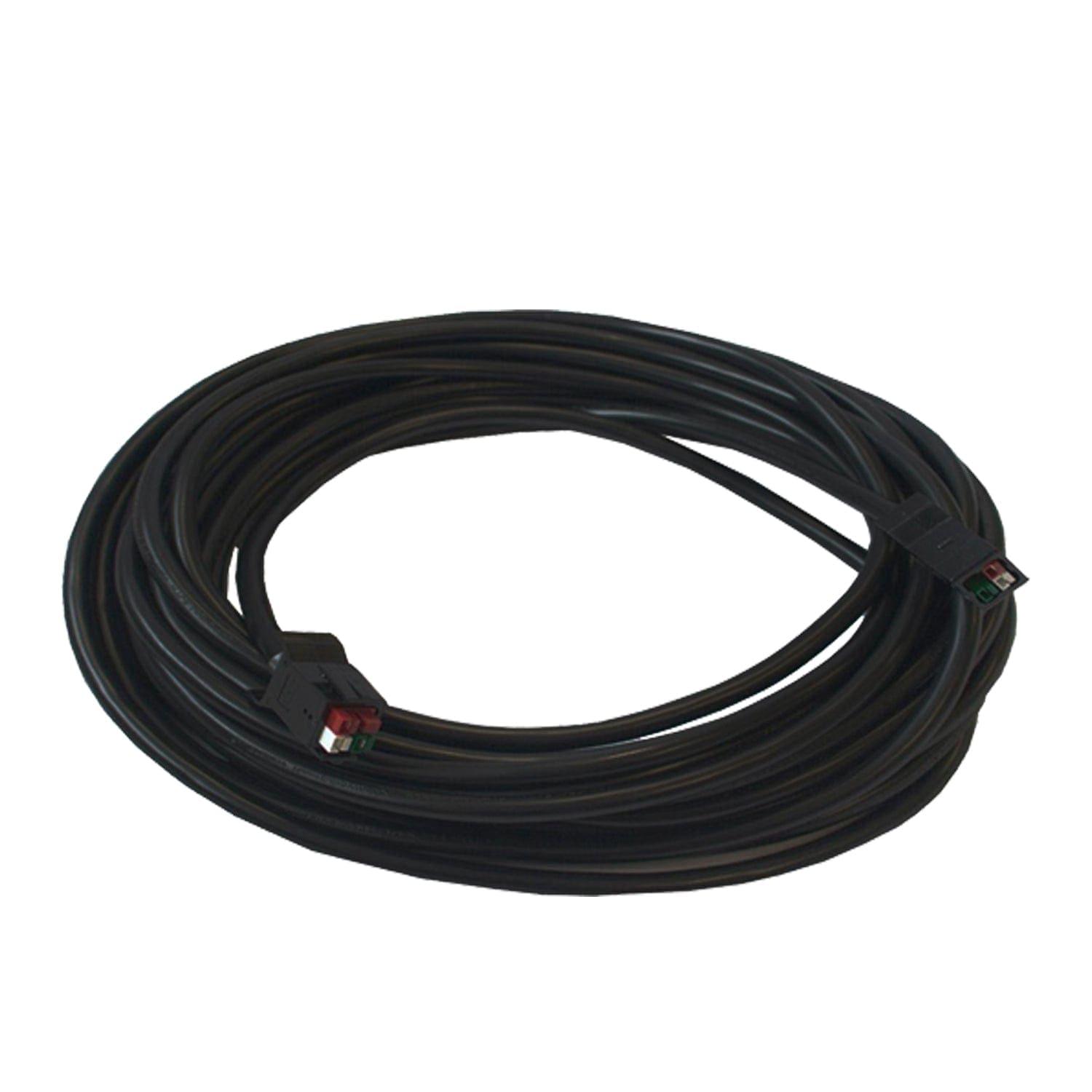 A coiled black extension cable from Nature's Generator, featuring two rectangular connectors with red, green, and black terminals at each end, is displayed on a plain white background.