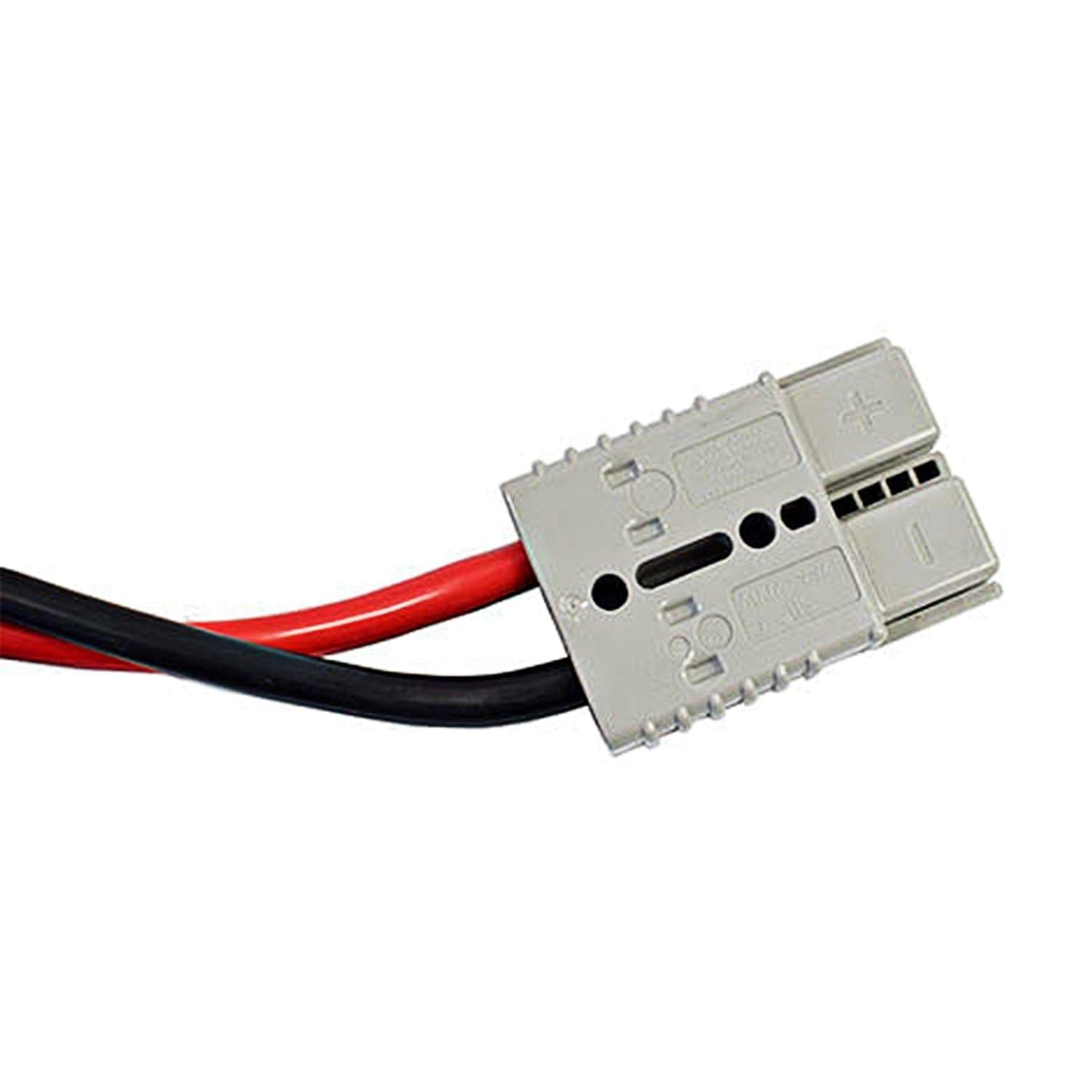 A close-up of a gray electrical power connector by Nature's Generator, showing labeled positive/negative terminals, red and black battery jumpstart cable slots, and several notches for secure attachment.