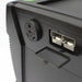 Close-up of a black Nature's Generator device featuring two rectangular ports behind an open plastic cover and a round socket labeled "Essential Plug," designed for home battery backup or off-grid power.
