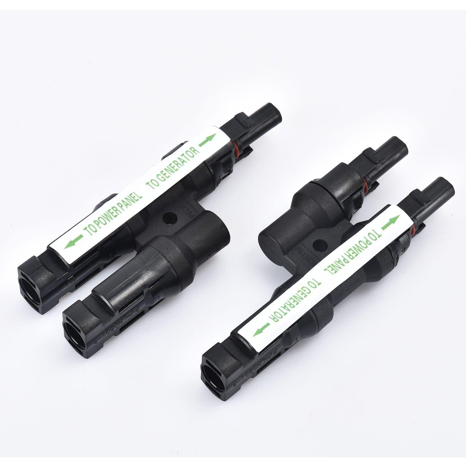 Two black Nature's Generator plastic electrical connectors, ideal for solar panel or Elite generator power add-ons, are placed side by side on a white surface. Each features a white label with a green arrow and the texts "TO PANEL" and "TO GENERATOR.