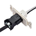A black plug is partially inserted into a white, wall-mounted Nature's Generator outlet. Ideal for indoor generator setup, two white wires and one black wire extend from the back of the outlet.