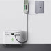 A Nature's Generator portable electric generator for home use on wheels is connected by a thick black cable to an electrical transfer switch and a main panel mounted on a white wall.