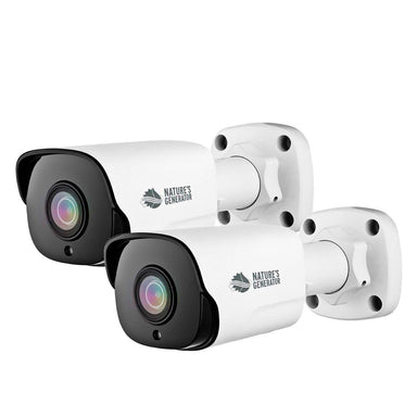 Two white Nature's Generator home security cameras are mounted on white wall brackets, angled left. With black front panels and multi-colored lenses, these 5MP wide-angle cameras feature advanced AI detection.