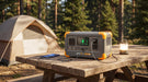 Pecron E300LFP portable power station charging devices at a campsite