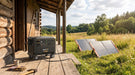 Pecron F5000LFP portable power station charging from solar panels at an off-grid homestead