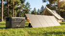 Pecron PV200 200W solar panel charging a Pecron power station at a campsite