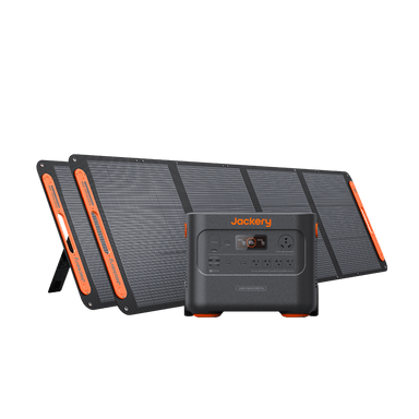 A portable Jackery solar generator with multiple input/output ports is displayed in front of three foldable solar panels, set against a plain white background.