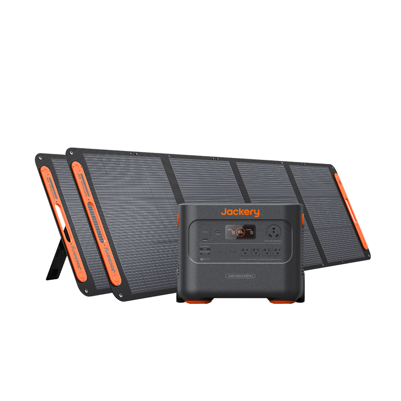 A portable Jackery solar generator with multiple input/output ports is displayed in front of three foldable solar panels, set against a plain white background.