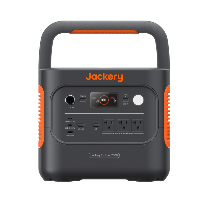 The Jackery Explorer 2000 LiFePO₄ portable generator features a handle, multiple front input/output ports including AC outlets and USB ports, an easy-to-read display screen, and distinctive orange side accents.